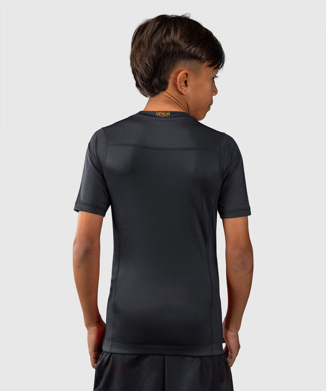 Rashguard Venum Attack Mâneci Scurte Copii – Negru/Auriu