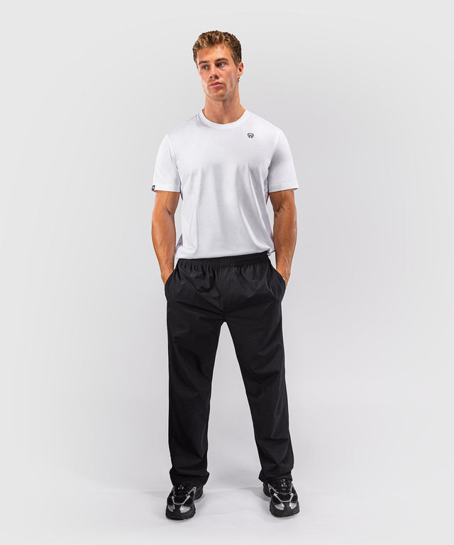 Pantaloni de antrenament Venum Essential Woven – Negru