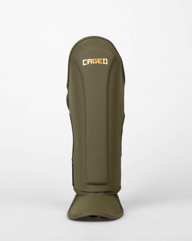Caneleiras Caged Spark Criança – Caqui/Ouro