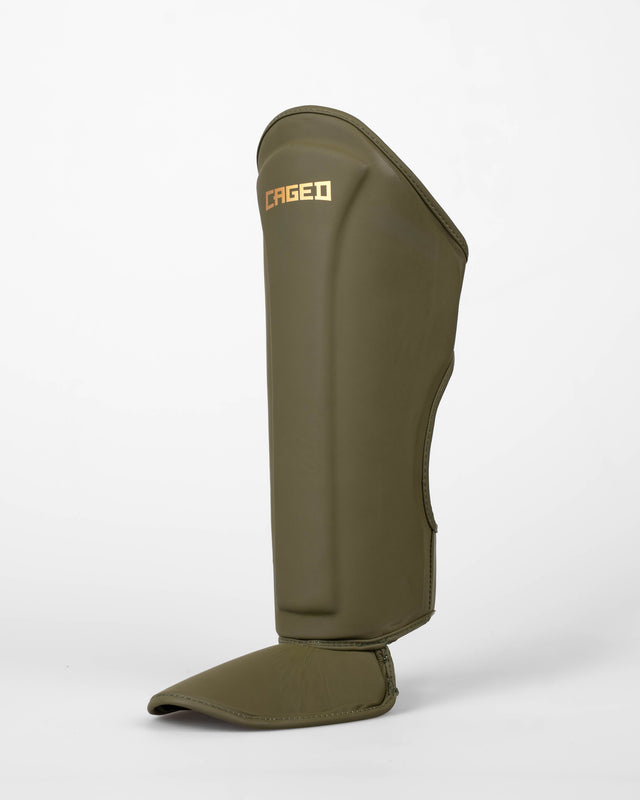 Caneleiras Caged Spark Criança – Caqui/Ouro