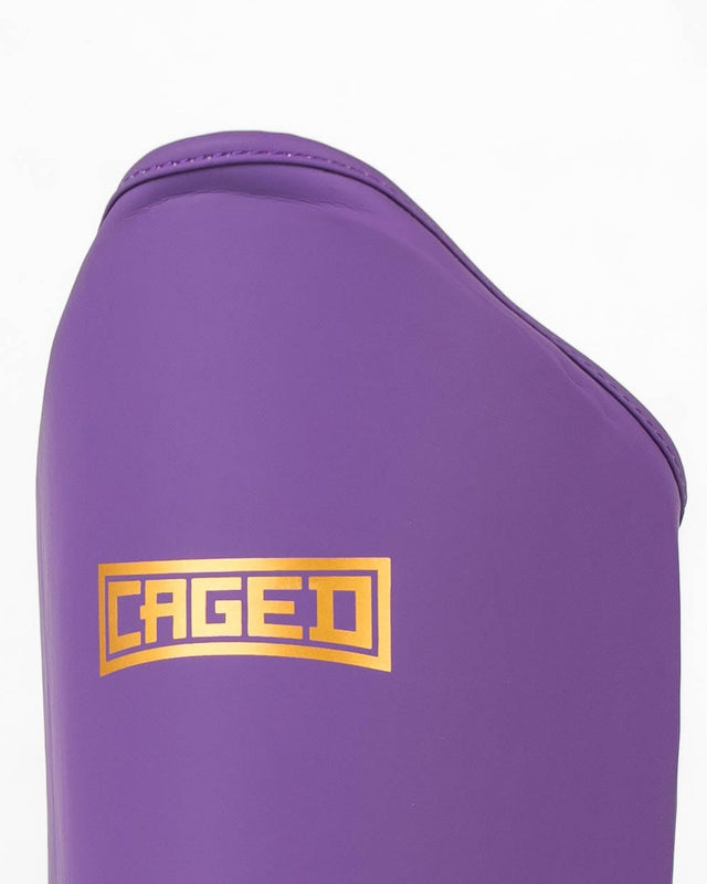 Caneleiras Caged Shadow – Roxo/Ouro