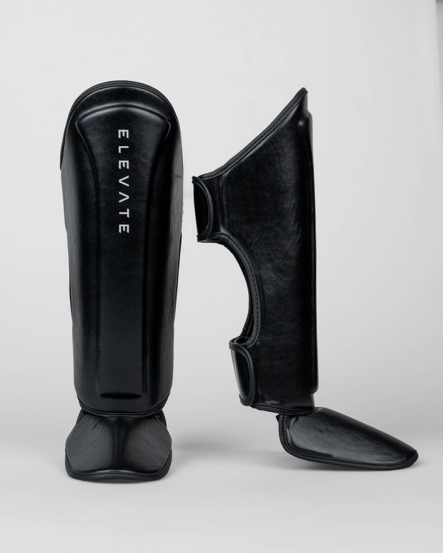 Espinilleras Elevate Prime Niños – Negro