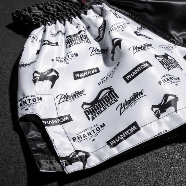 Pantaloni scurți Muay Thai Phantom Athletics Legend – Negru/Alb