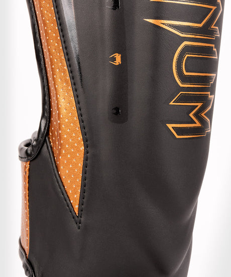 Venum Schienbeinschoner Kickbox Elite Evo – Schwarz/Bronze
