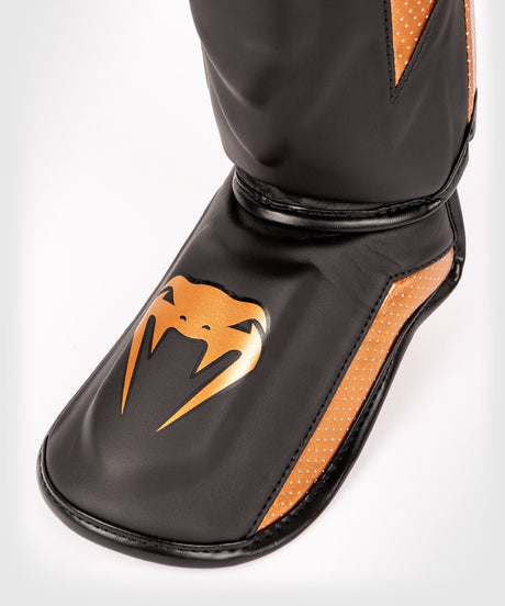 Venum Schienbeinschoner Kickbox Elite Evo – Schwarz/Bronze