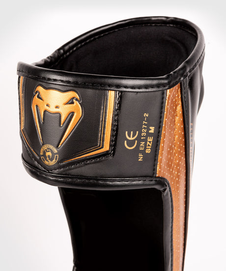 Venum Schienbeinschoner Kickbox Elite Evo – Schwarz/Bronze
