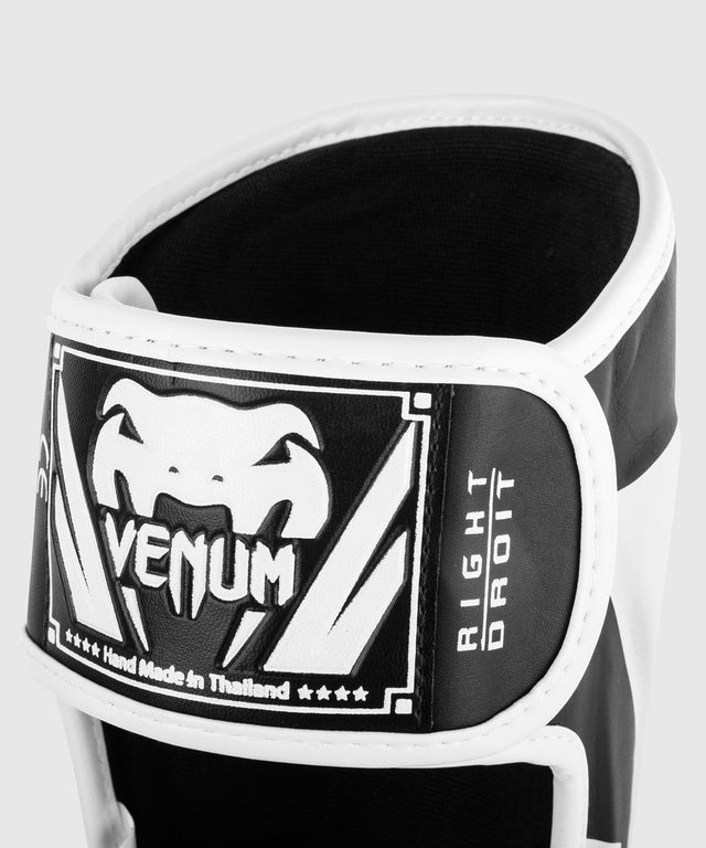 Espinilleras Venum Elite – Negro/Blanco