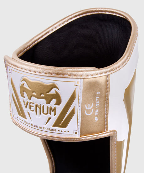 Caneleiras de kickboxing Venum Elite – Branco/Ouro