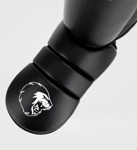 Caneleiras de kickboxing Super Pro Protector – Preto/Branco – Caneleiras